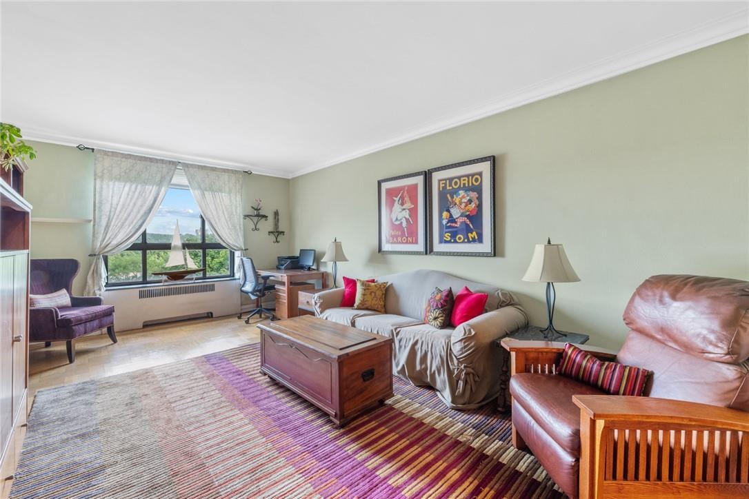 4445 Post Road, Unit 7D Bronx, NY 10471 - Photo 2 of 13 Living room with ornamental molding and radiator heating unit
