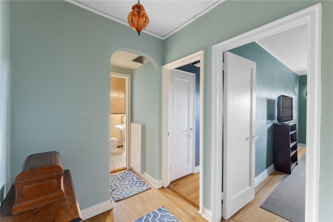 4445 Post Road, Unit 7D Bronx, NY 10471 - Photo 8 of 13 Hall with crown molding and light wood-type flooring