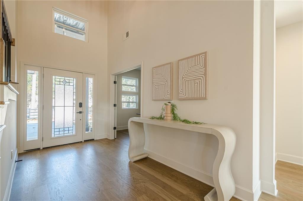 5249 Moon Road Powder Springs, GA 30127 - Photo 21 of 43 a view of a hallway with wooden floor and cabinet