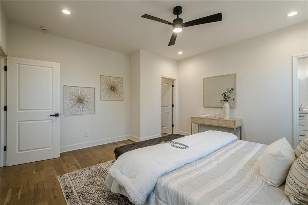 5249 Moon Road Powder Springs, GA 30127 - Photo 34 of 43 a bedroom with a bed and a chandelier