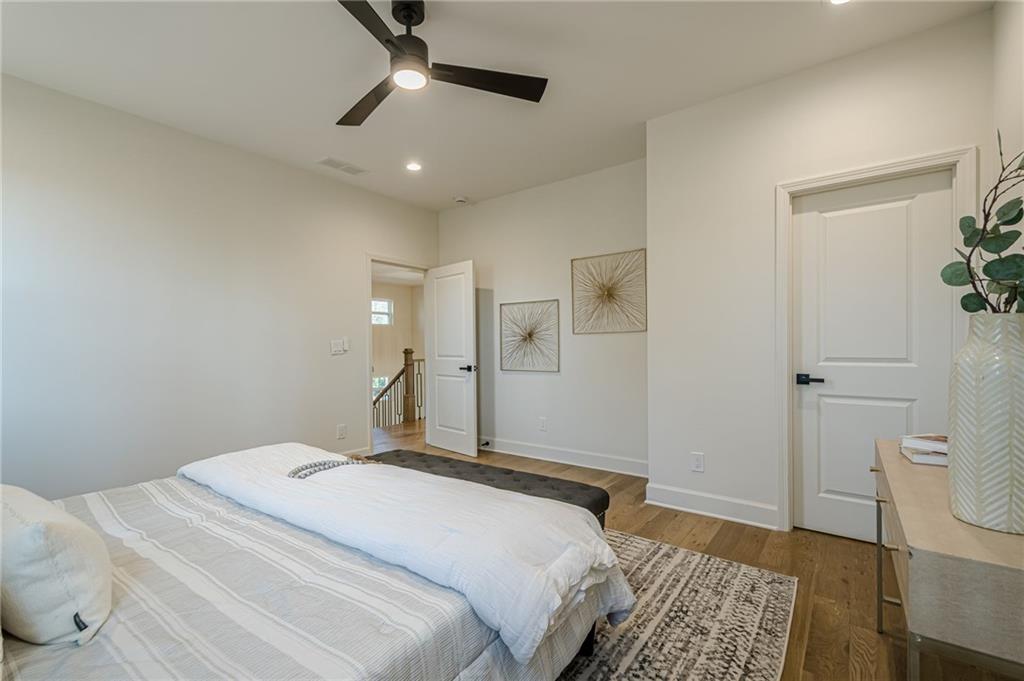 5249 Moon Road Powder Springs, GA 30127 - Photo 38 of 43 a bedroom with a bed and a lamp