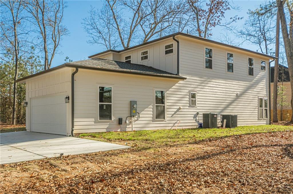 5249 Moon Road Powder Springs, GA 30127 - Photo 40 of 43 a front view of a house with a yard