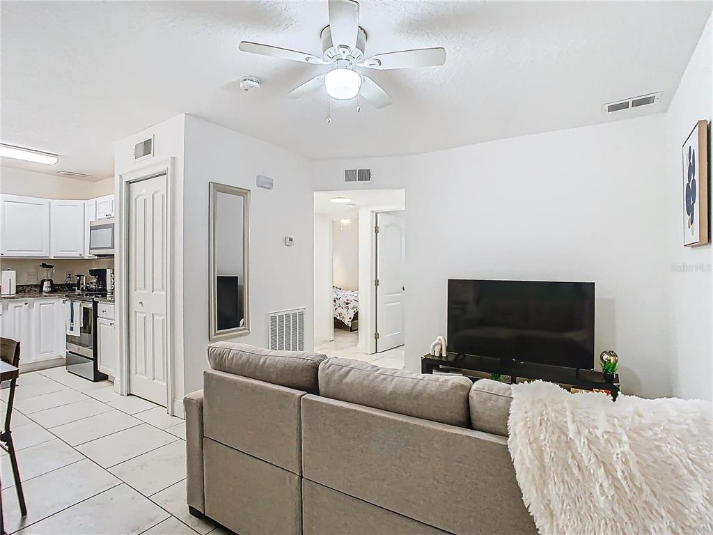3025 Long Street Orlando, FL 32805 - Photo 4 of 24 a living room with furniture and a flat screen tv