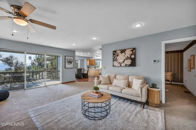 a kitchen with a sink and chairs