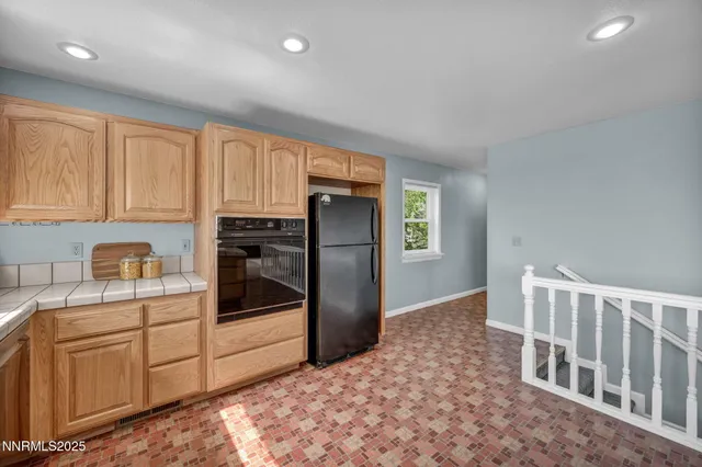 a bathroom with a granite countertop bathtub a shower and a sink