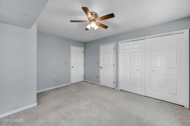 an aerial view of a house with a mountain