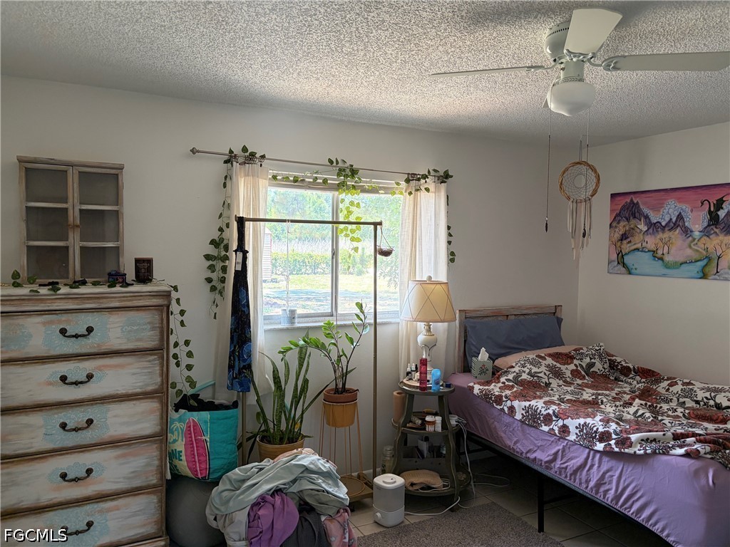 2175 Twin Brooks Road North Fort Myers, FL 33917 - Photo 8 of 27 a bedroom with a bed and a window