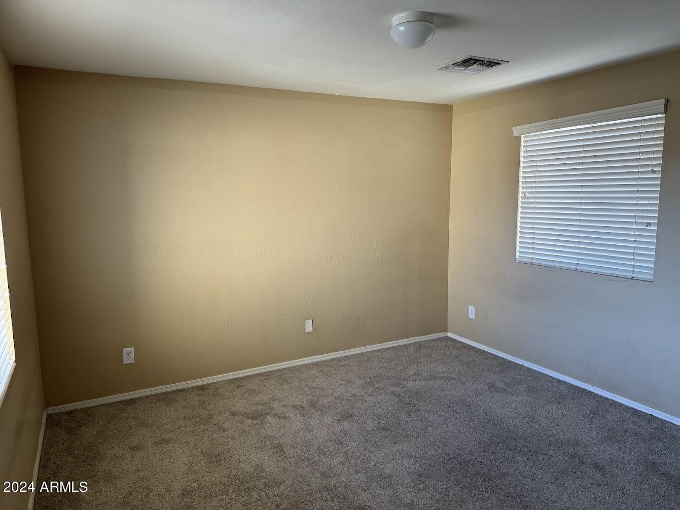 5322 Odeum Lane Phoenix, AZ 85043 - Photo 11 of 19 an empty room with a window