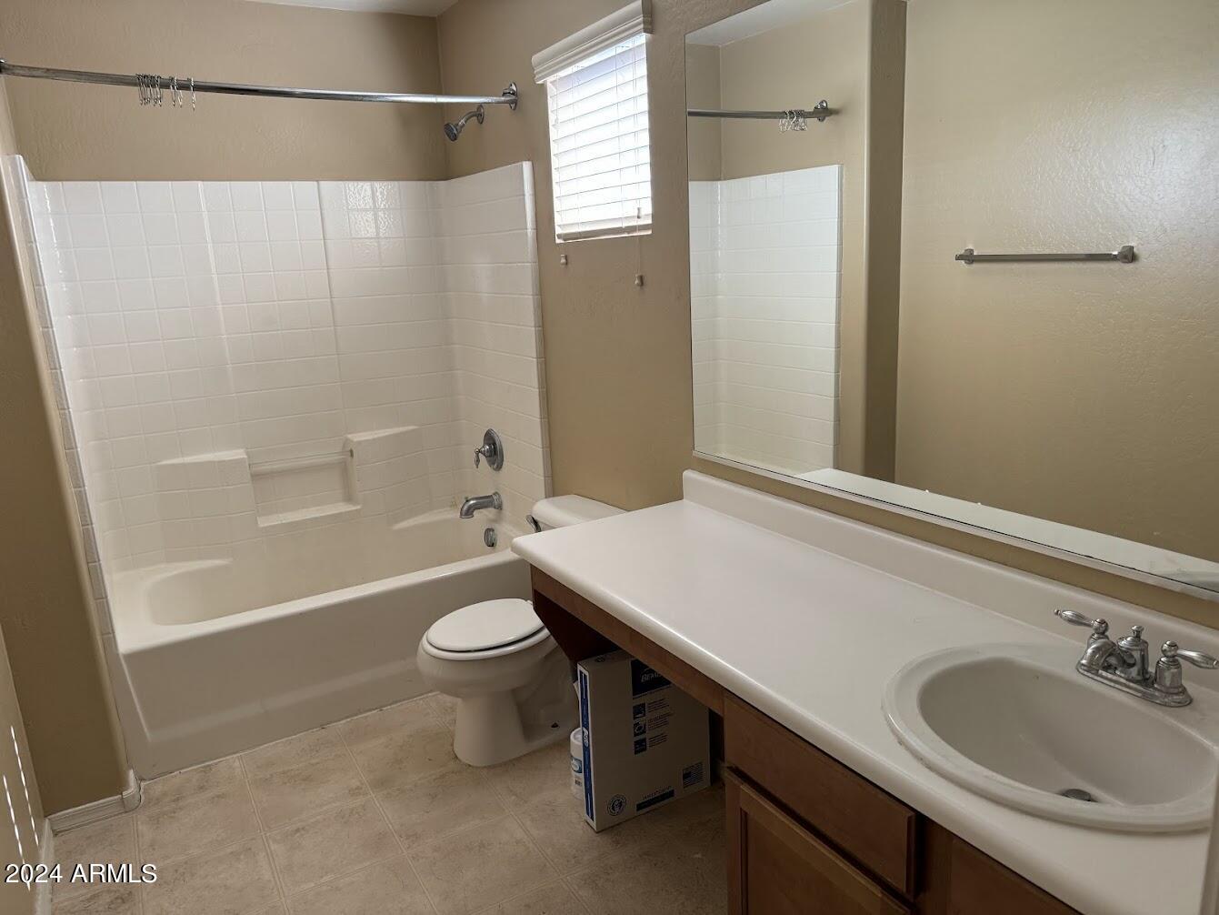 5322 Odeum Lane Phoenix, AZ 85043 - Photo 13 of 19 a bathroom with a sink a toilet and shower