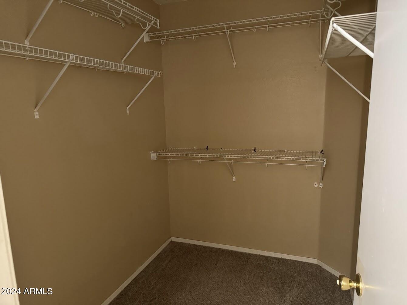 5322 Odeum Lane Phoenix, AZ 85043 - Photo 14 of 19 a view of a room with racks on the wall