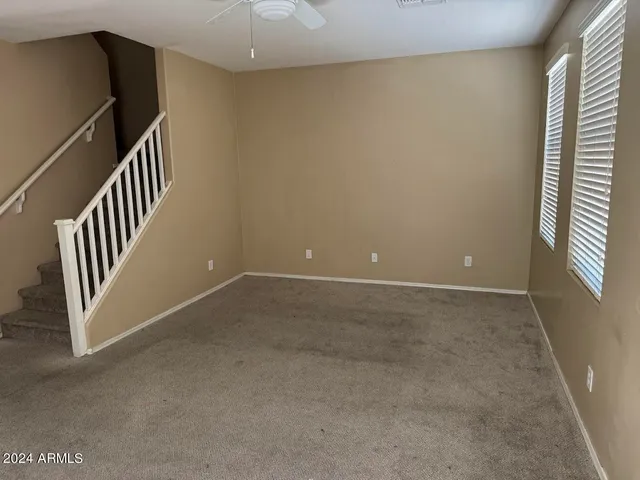 a view of an empty room with stairs