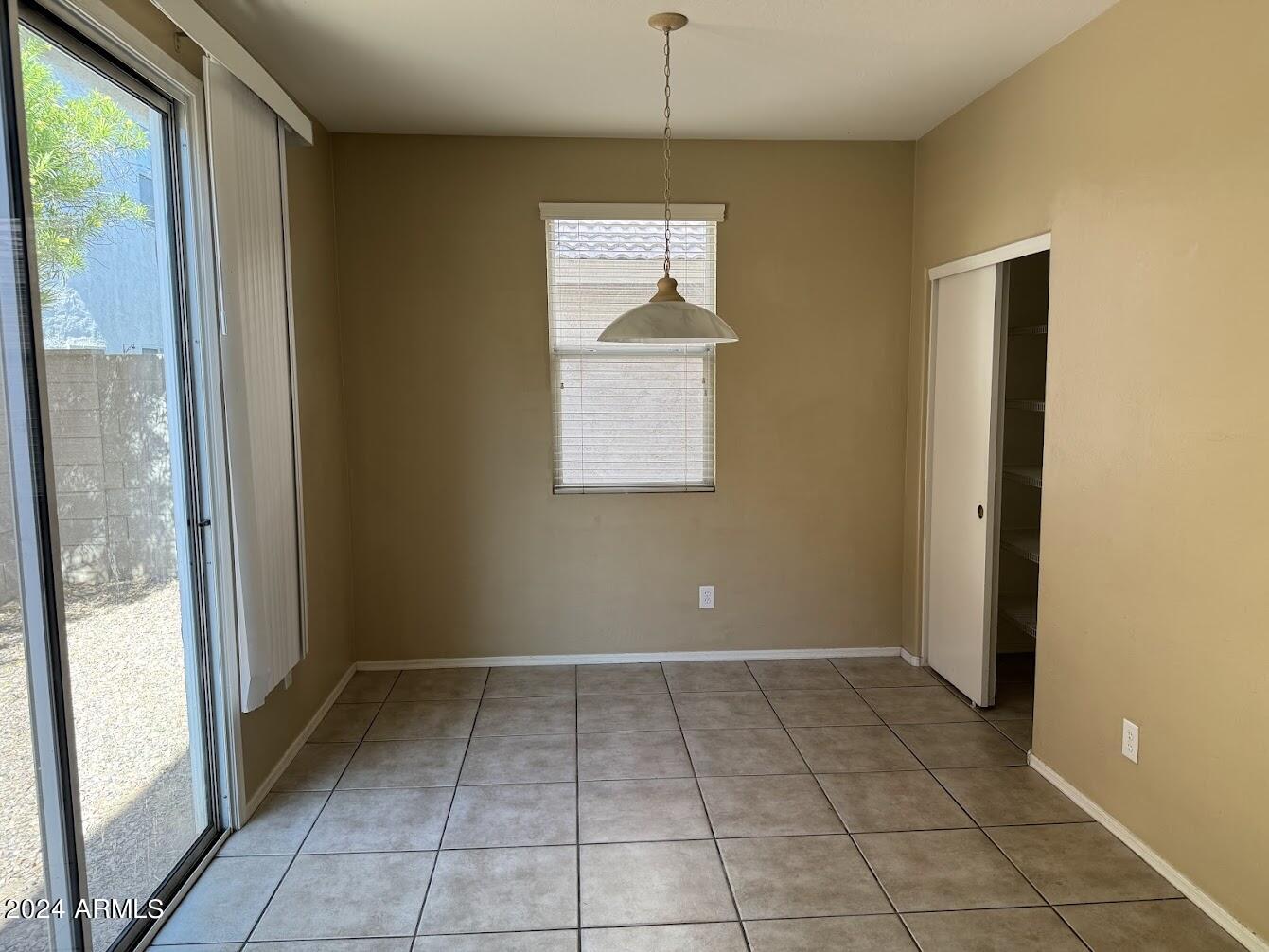 5322 Odeum Lane Phoenix, AZ 85043 - Photo 6 of 19 a view of an empty room with a window