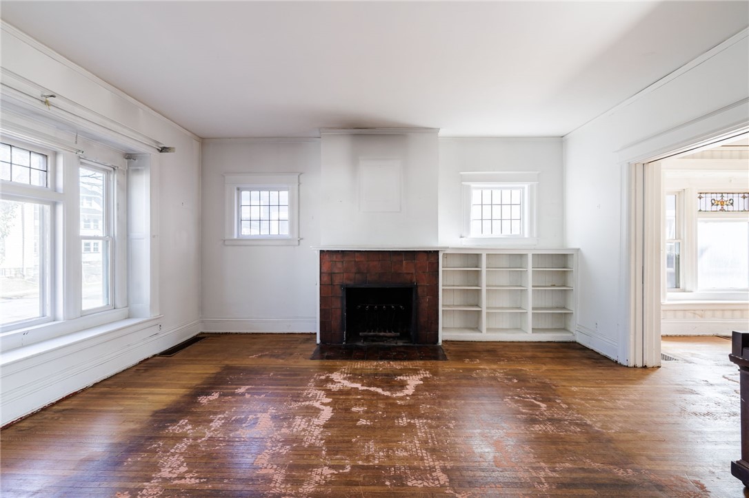757 Harvard Street Rochester, NY 14610 - Photo 7 of 39 Living Room w/ Wood burning FP