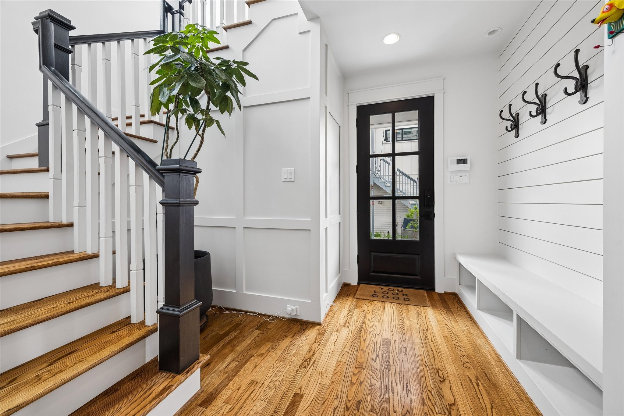 402 East 26th Street Houston, TX 77008 - Photo 17 of 35 a view of entryway with wooden floor and stairs