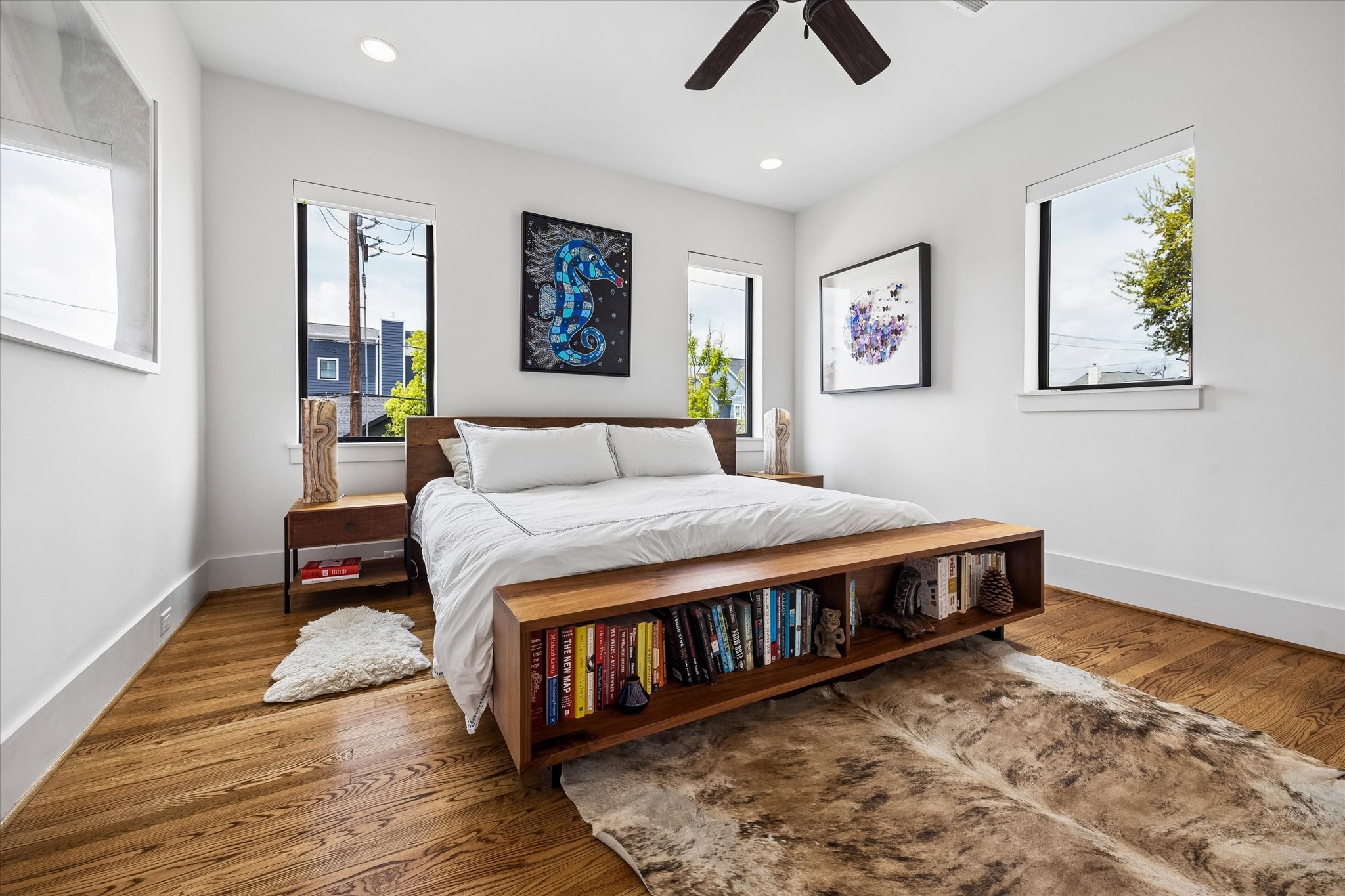 402 East 26th Street Houston, TX 77008 - Photo 19 of 35 a bedroom with a bed a dresser and wooden floor