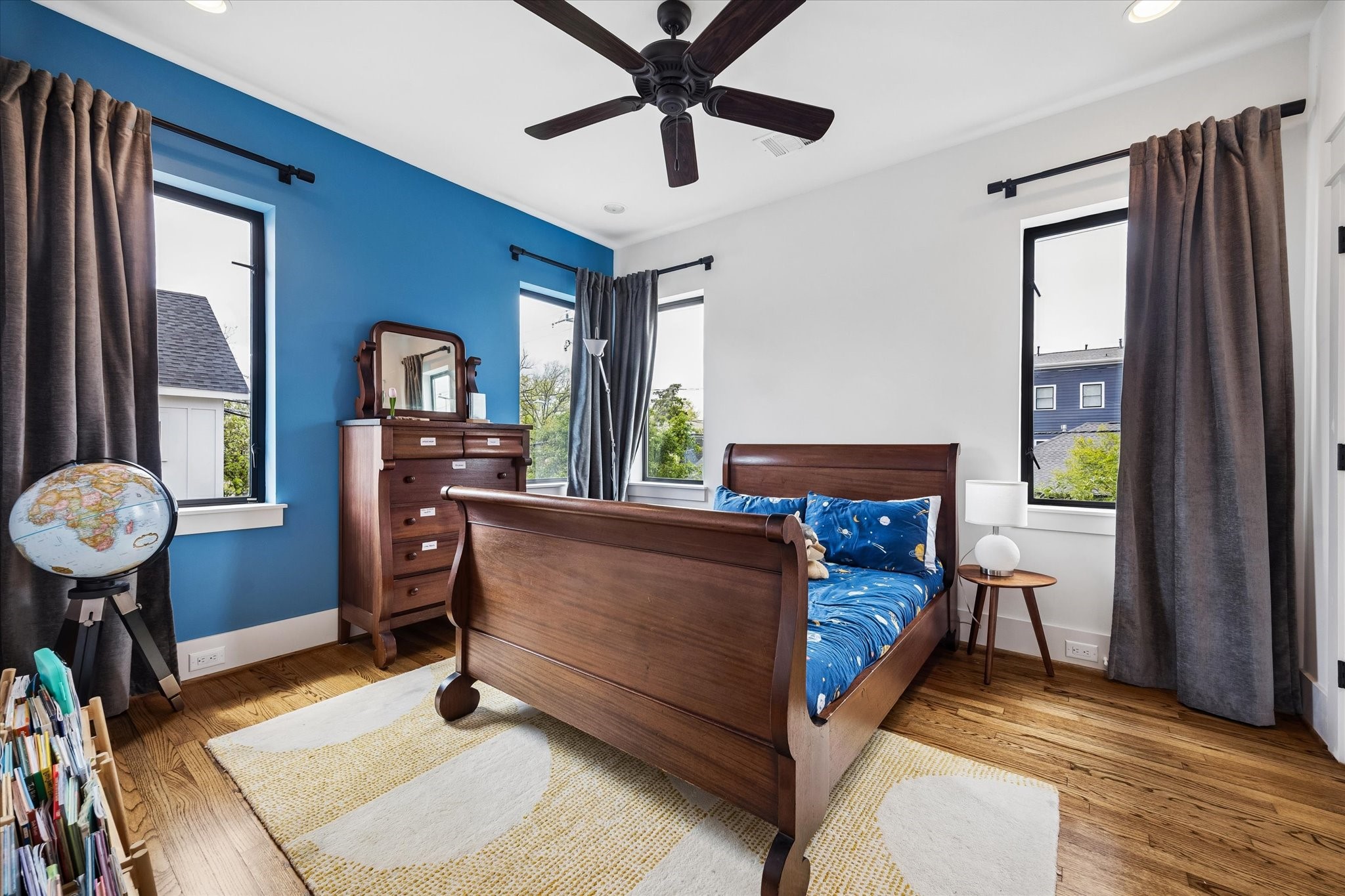 402 East 26th Street Houston, TX 77008 - Photo 26 of 35 a bed room with a bed and a chandelier