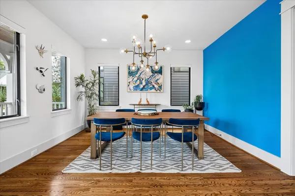 a living room with fireplace furniture and a chandelier