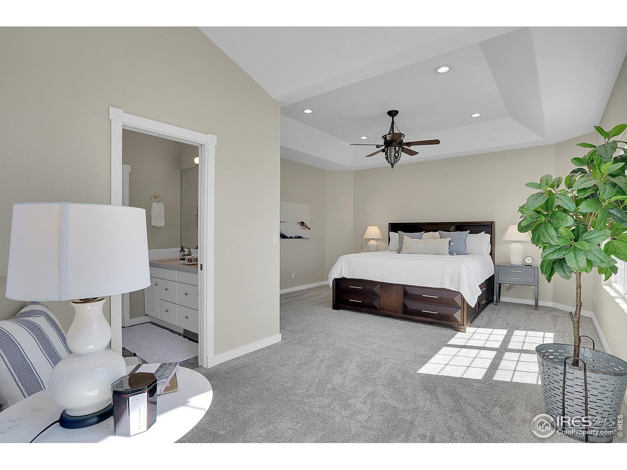 410 High Court Fort Collins, CO 80521 - Photo 13 of 37 a bedroom with a bed and a lamp