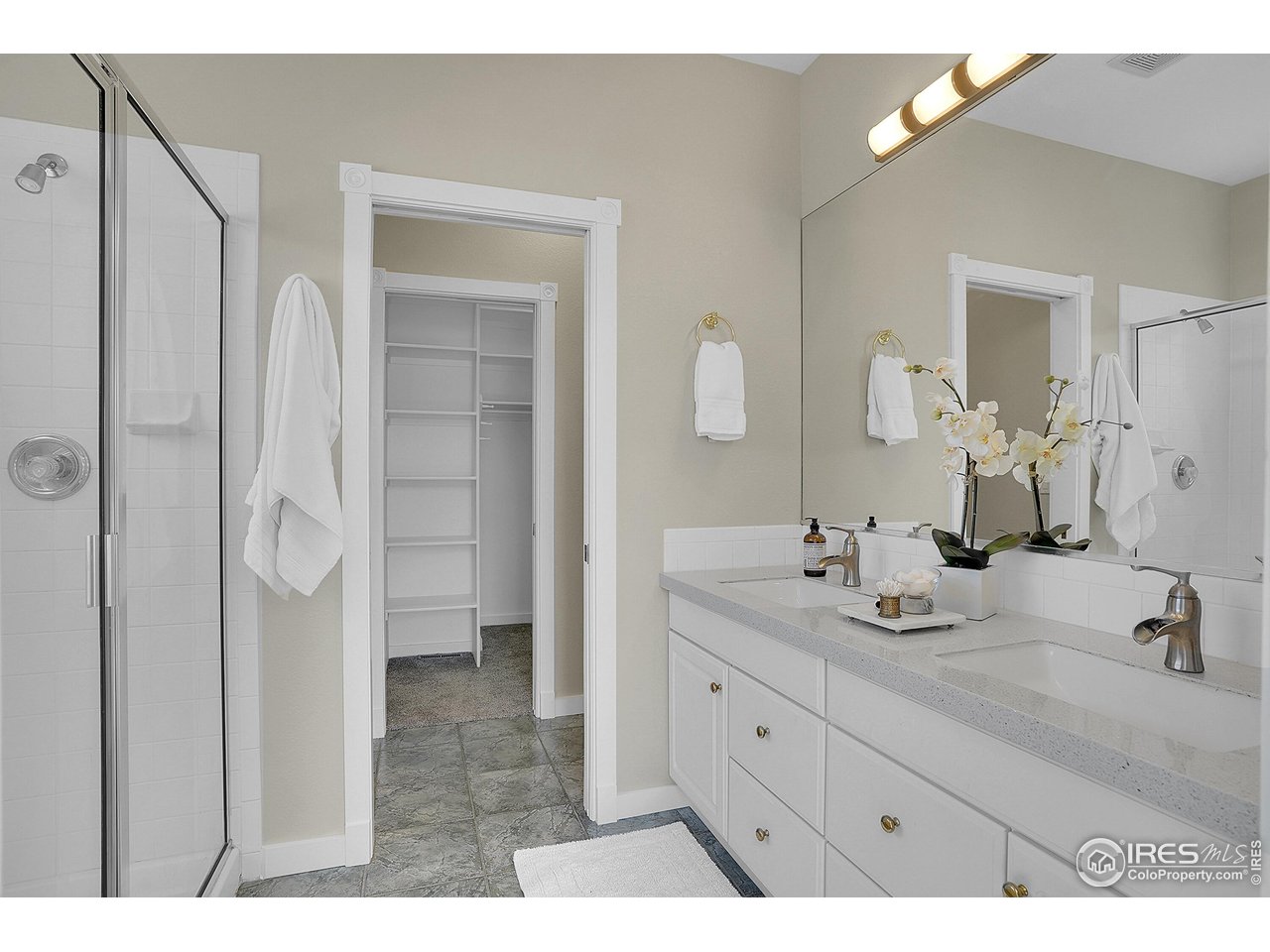 410 High Court Fort Collins, CO 80521 - Photo 15 of 37 a bathroom with a double vanity sink mirror and shower