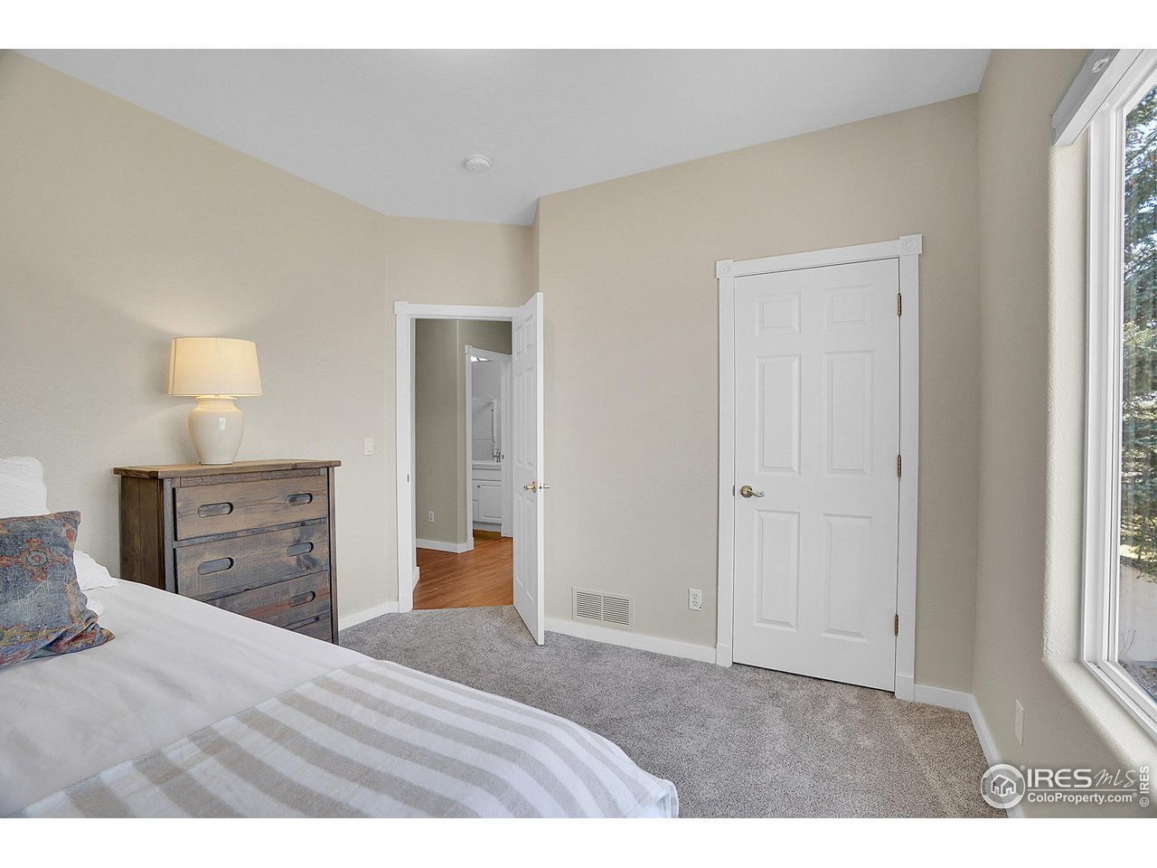 410 High Court Fort Collins, CO 80521 - Photo 16 of 37 a bedroom with a bed and a dresser