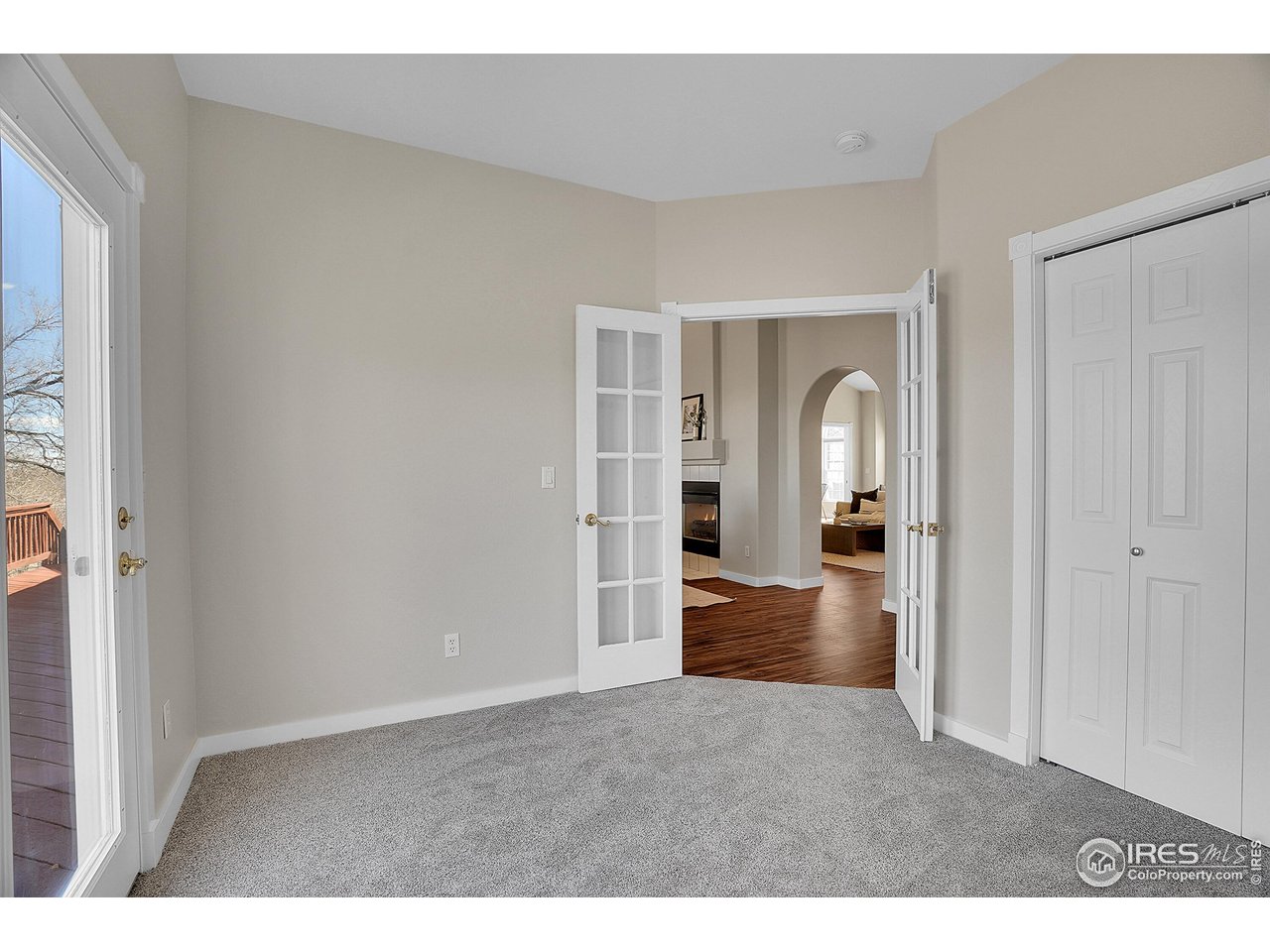 410 High Court Fort Collins, CO 80521 - Photo 17 of 37 view of living room with furniture and floor to ceiling window