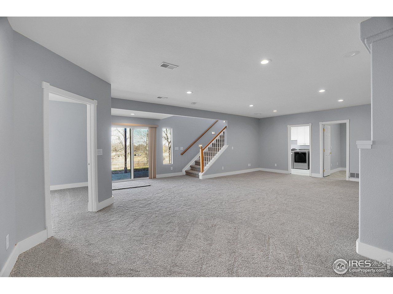 410 High Court Fort Collins, CO 80521 - Photo 19 of 37 a view of a livingroom with an empty space and a window
