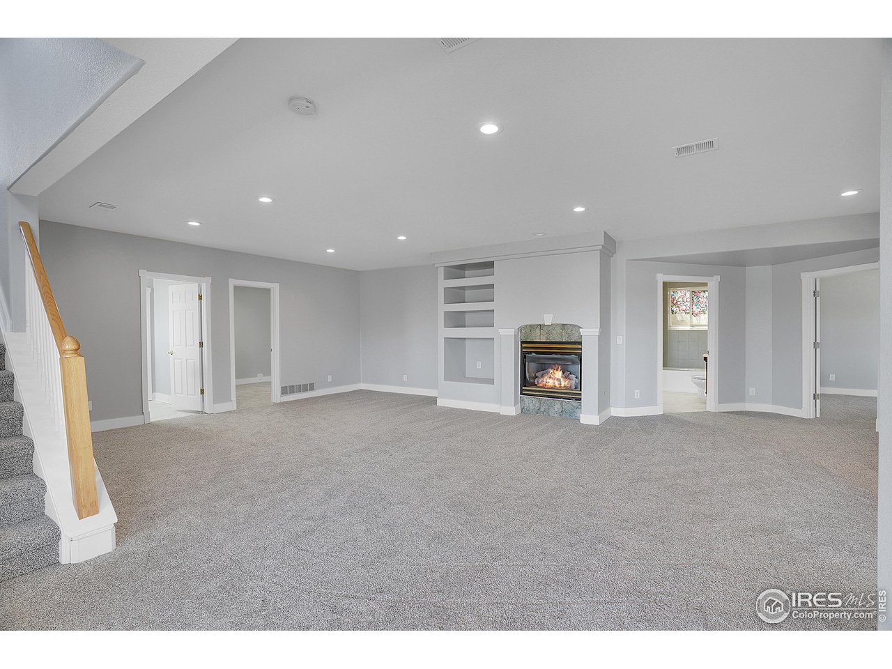 410 High Court Fort Collins, CO 80521 - Photo 20 of 37 a living room with furniture and a fireplace