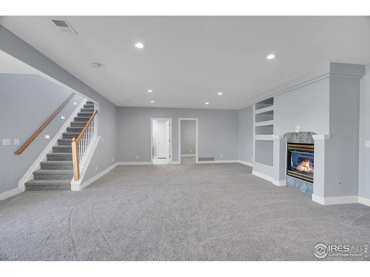 410 High Court Fort Collins, CO 80521 - Photo 21 of 37 a view of an empty room with a fireplace