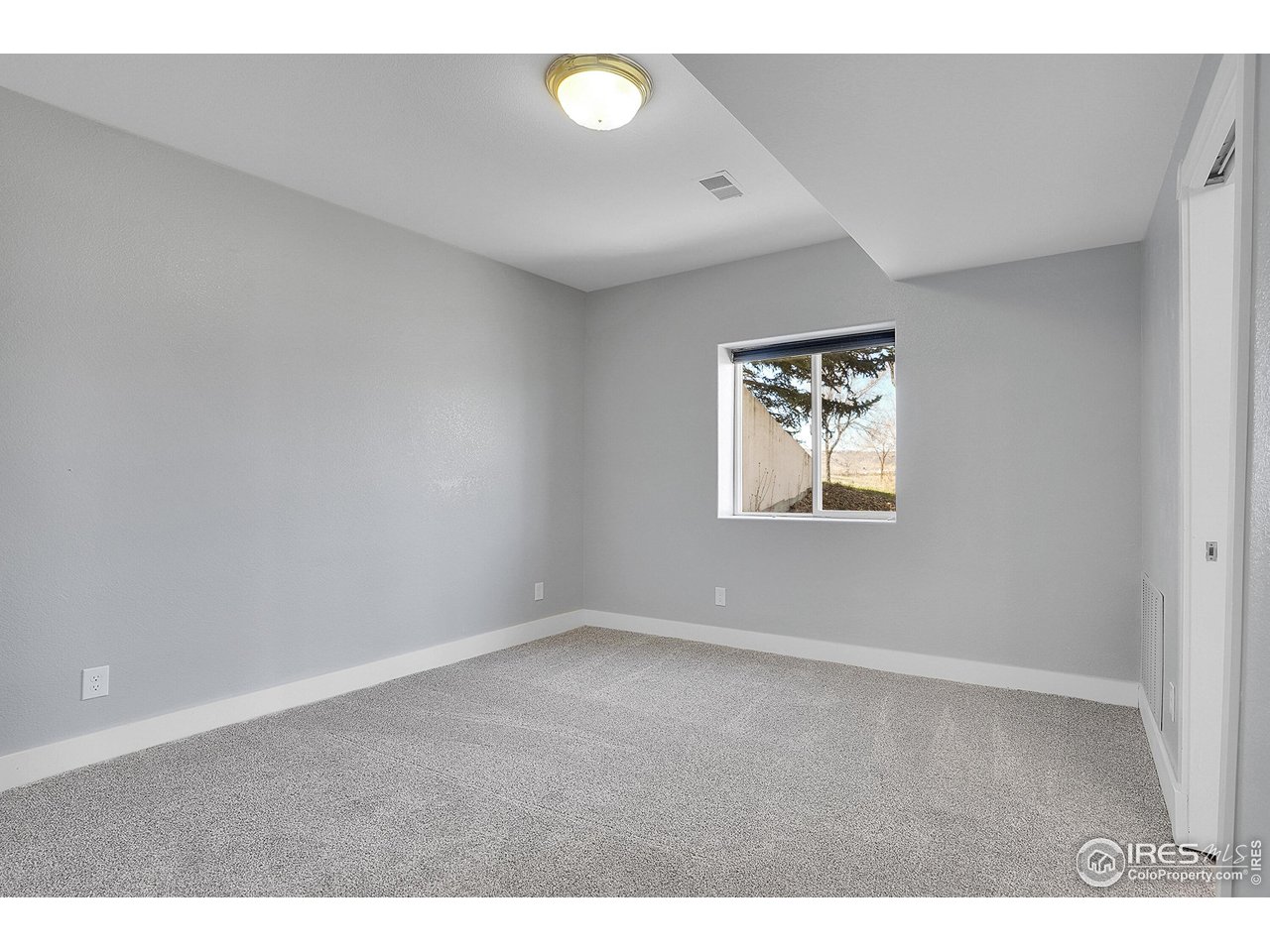 410 High Court Fort Collins, CO 80521 - Photo 23 of 37 an empty room with windows and closet