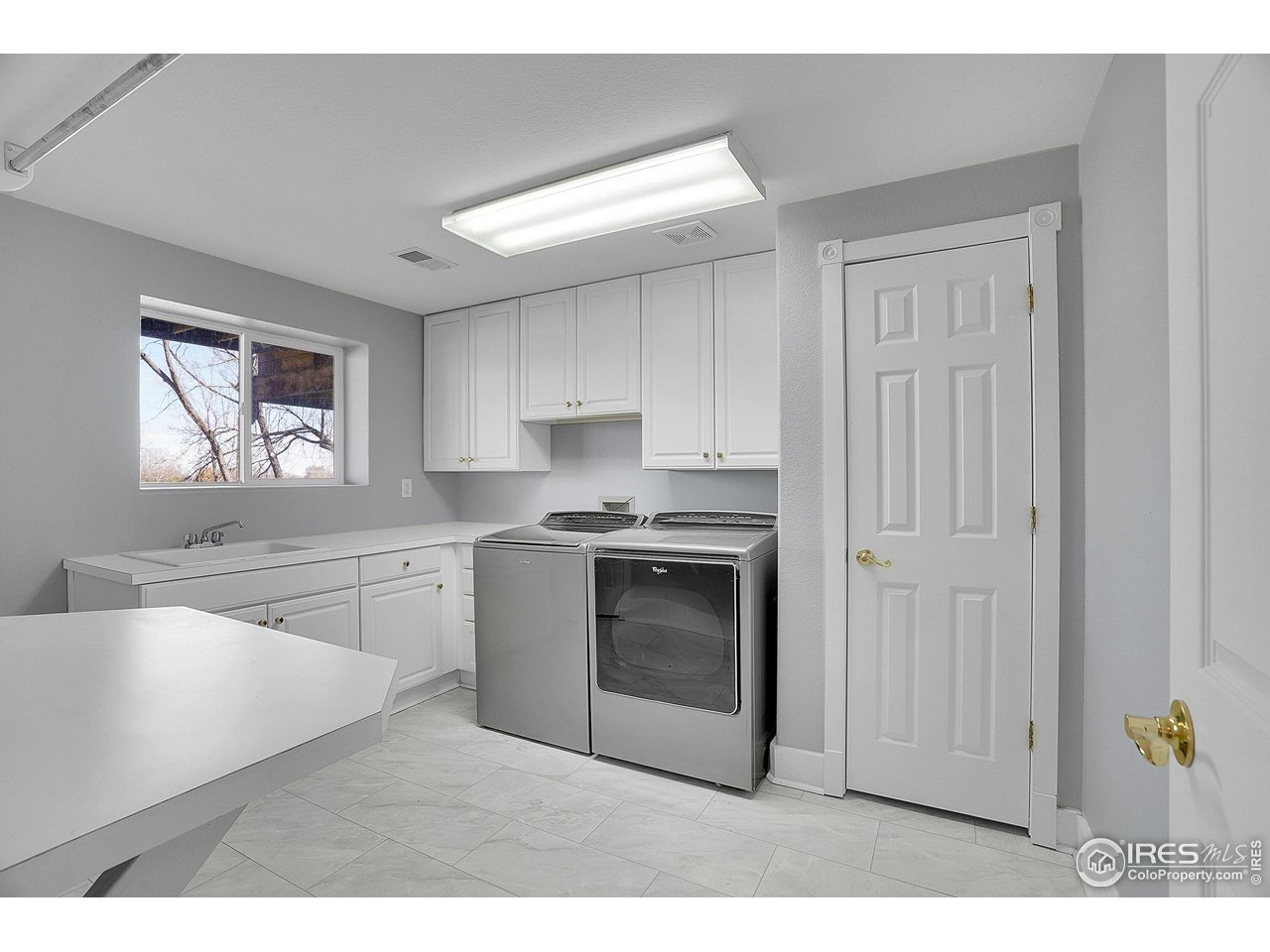 410 High Court Fort Collins, CO 80521 - Photo 26 of 37 a kitchen with granite countertop white cabinets and stainless steel appliances