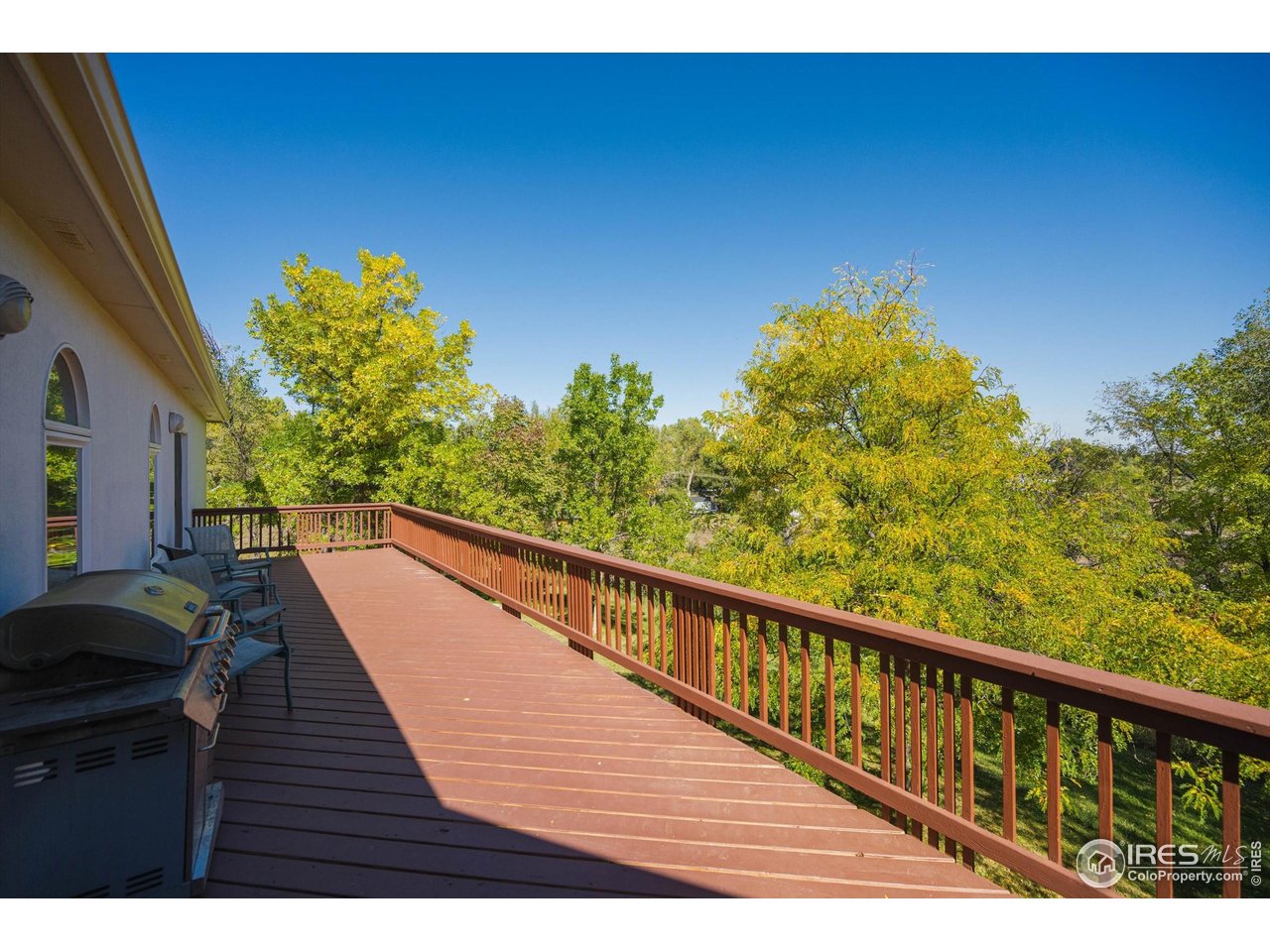 410 High Court Fort Collins, CO 80521 - Photo 29 of 37 a view of balcony with wooden floor and fence