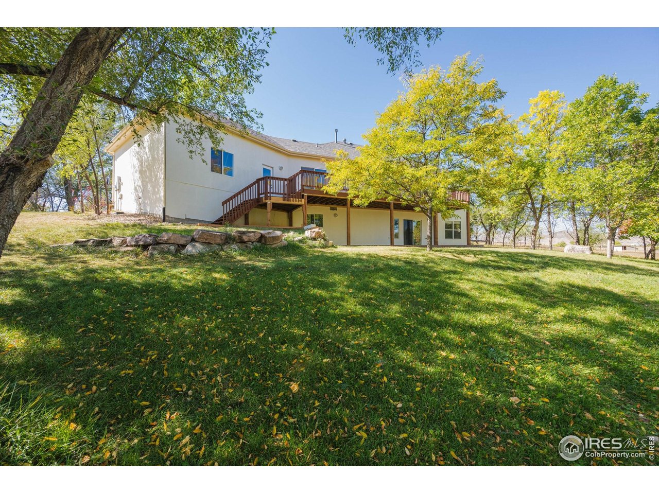 410 High Court Fort Collins, CO 80521 - Photo 30 of 37 a view of a house with a yard