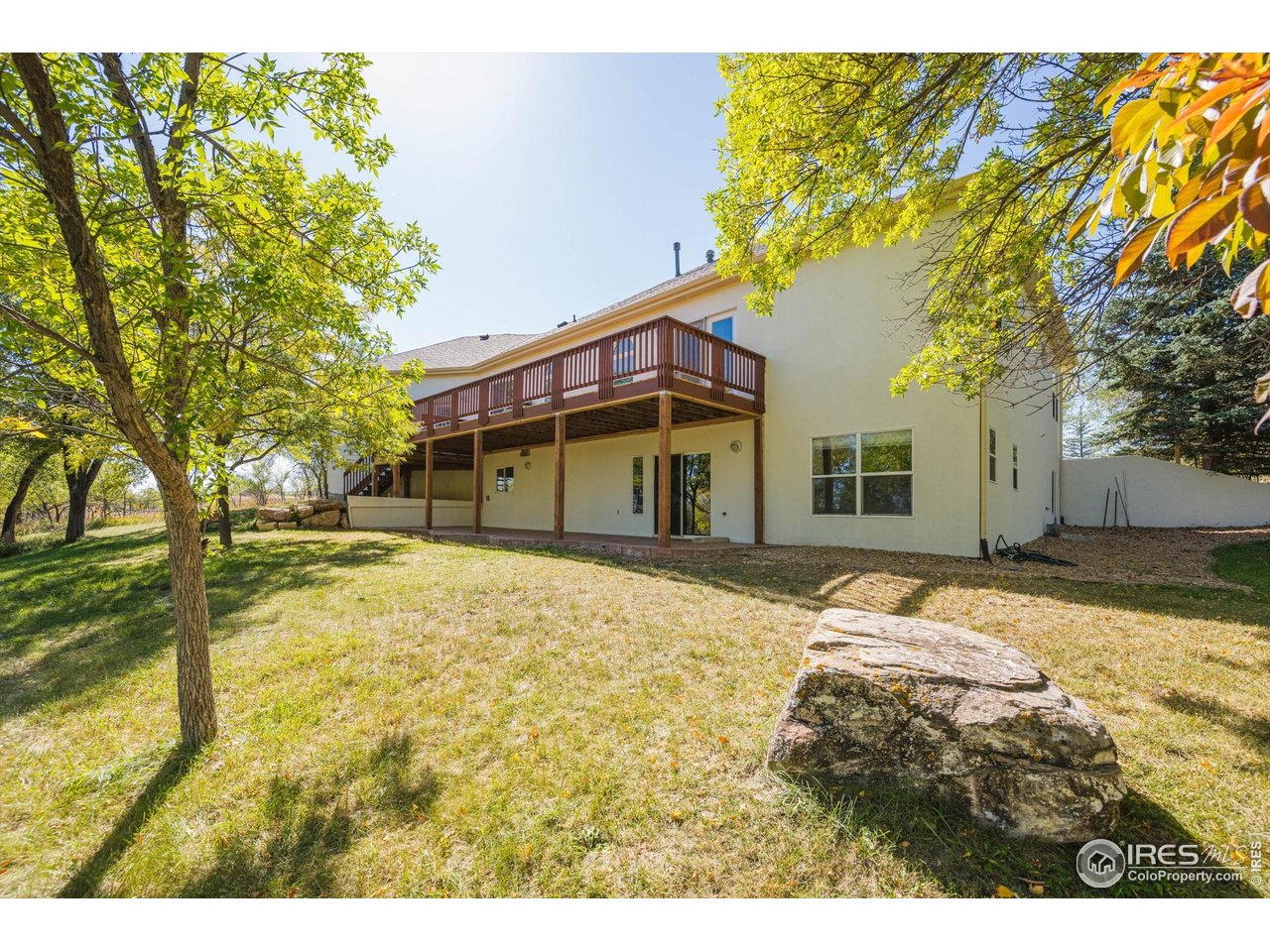 410 High Court Fort Collins, CO 80521 - Photo 31 of 37 a view of a house with a yard