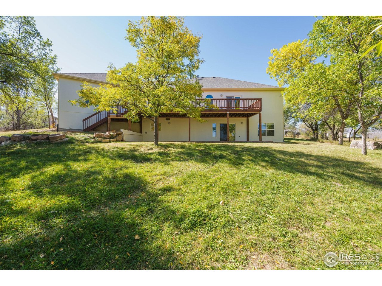 410 High Court Fort Collins, CO 80521 - Photo 34 of 37 a front view of a house with a garden