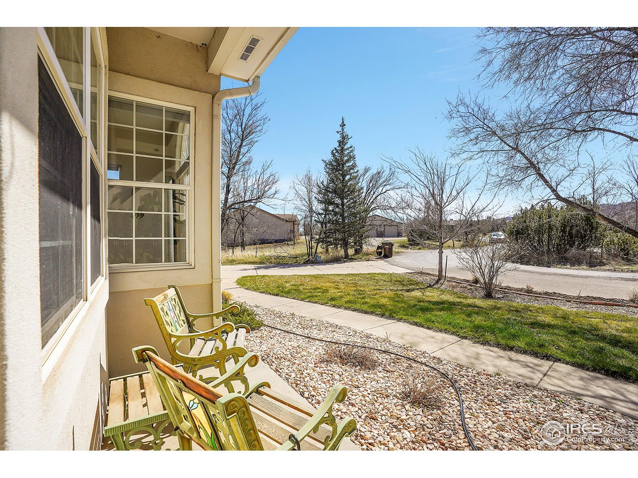 410 High Court Fort Collins, CO 80521 - Photo 4 of 37 a view of a house with a swimming pool and a yard
