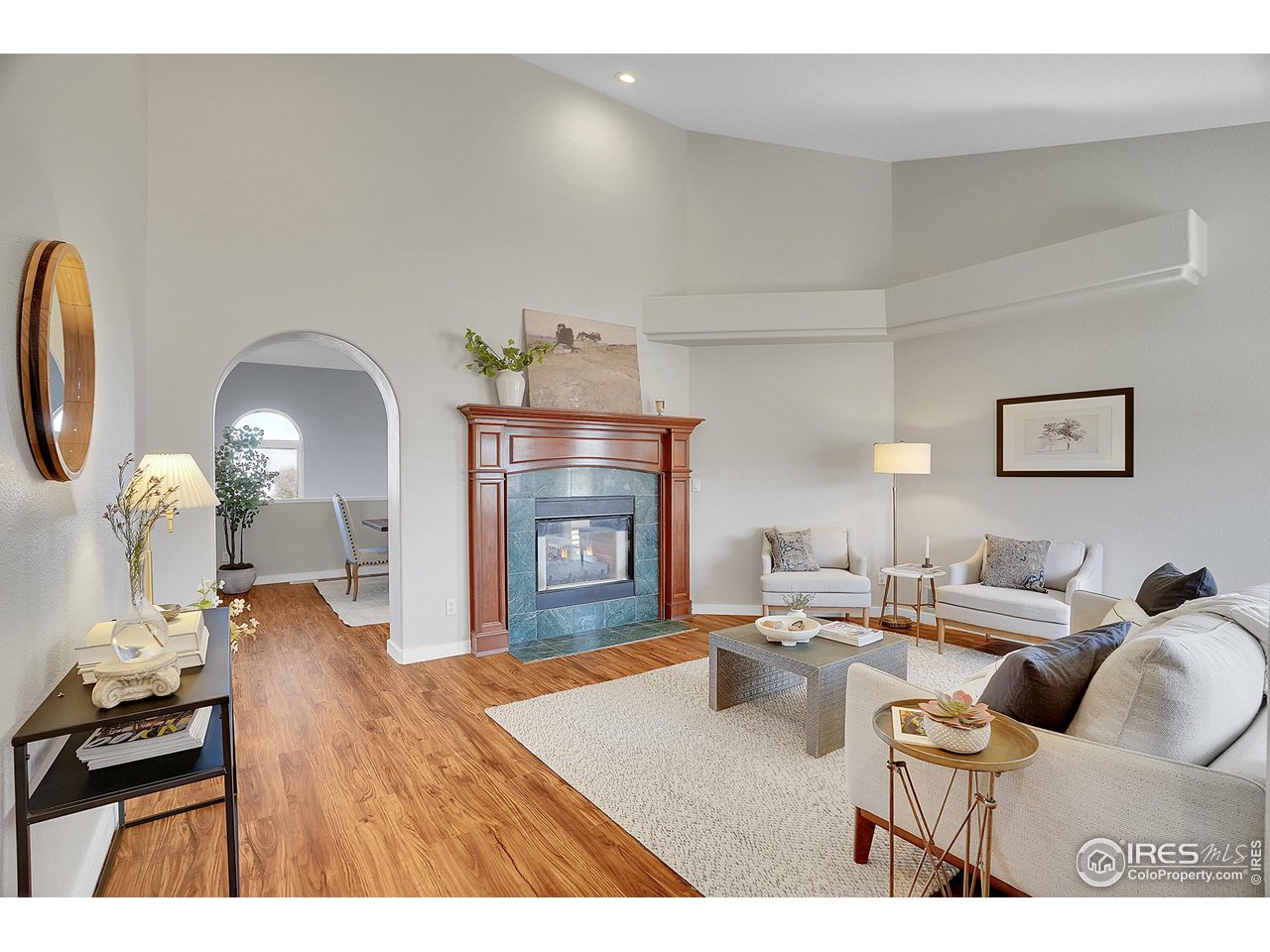 410 High Court Fort Collins, CO 80521 - Photo 5 of 37 a living room with furniture and a fireplace