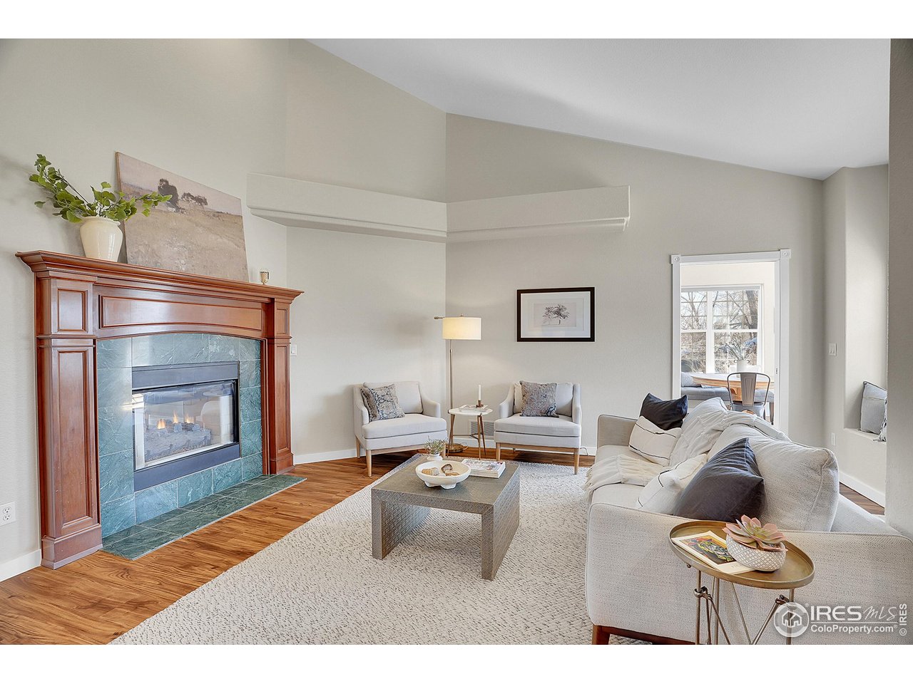 410 High Court Fort Collins, CO 80521 - Photo 6 of 37 a living room with furniture and a fireplace