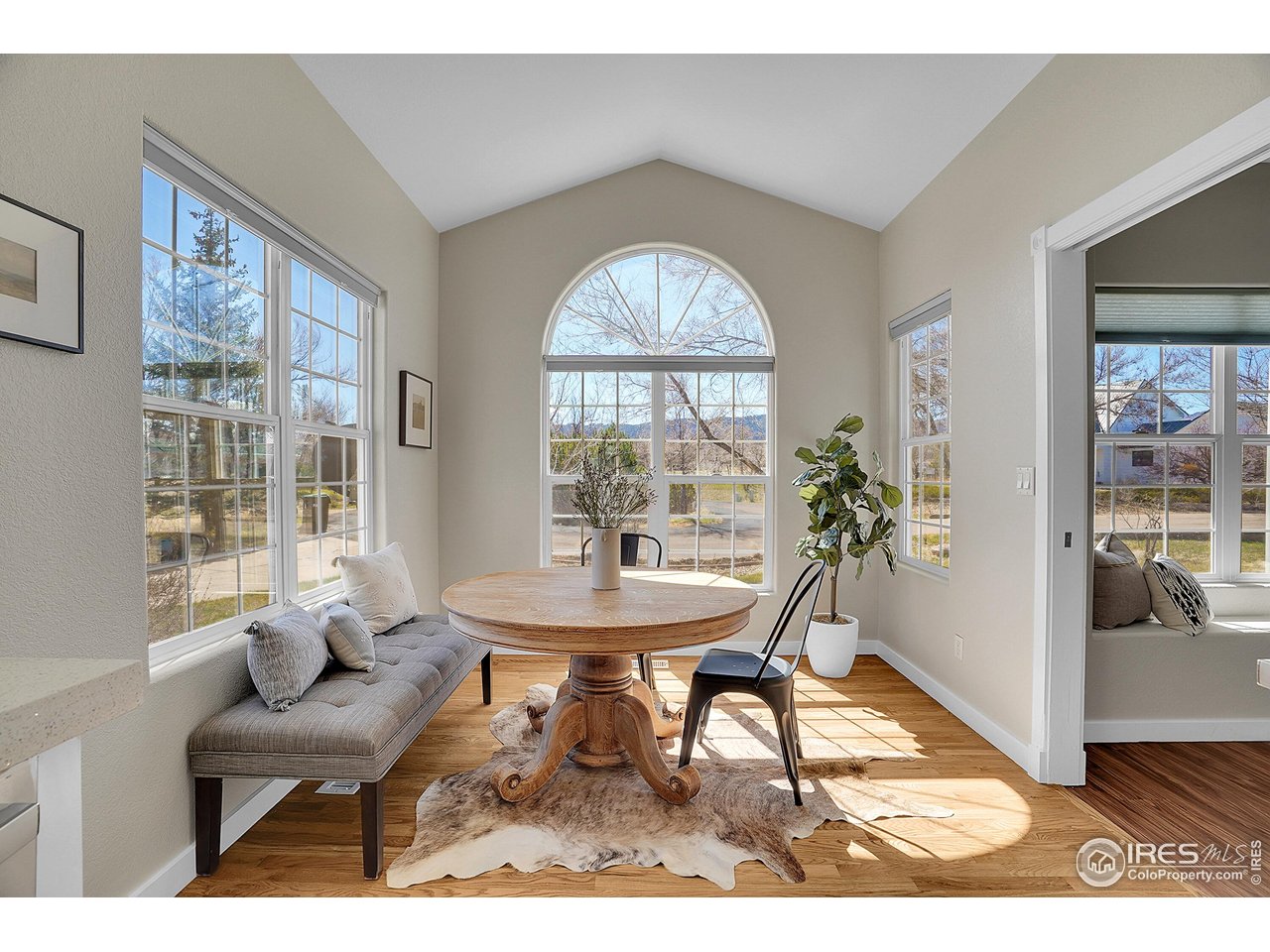 410 High Court Fort Collins, CO 80521 - Photo 9 of 37 a view of a dining room with furniture and a large window