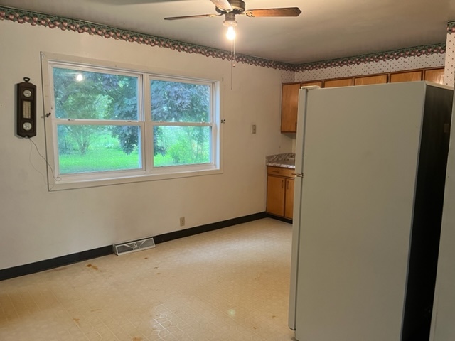 939 Lakeview Drive Rochelle, IL 61068 - Photo 6 of 19 a view of an empty room with a window