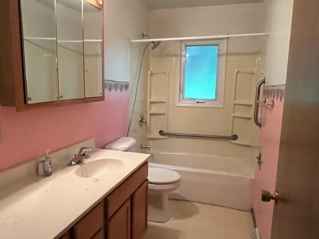 939 Lakeview Drive Rochelle, IL 61068 - Photo 7 of 19 a bathroom with a sink toilet and shower