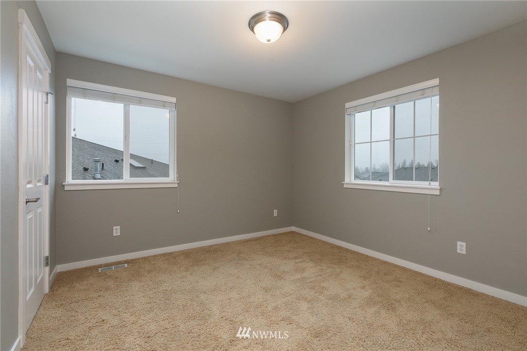 4328 216th Place Southeast Bothell, WA 98021 - Photo 22 of 28 an empty room with windows