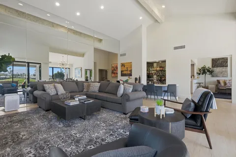 a living room with furniture and a table