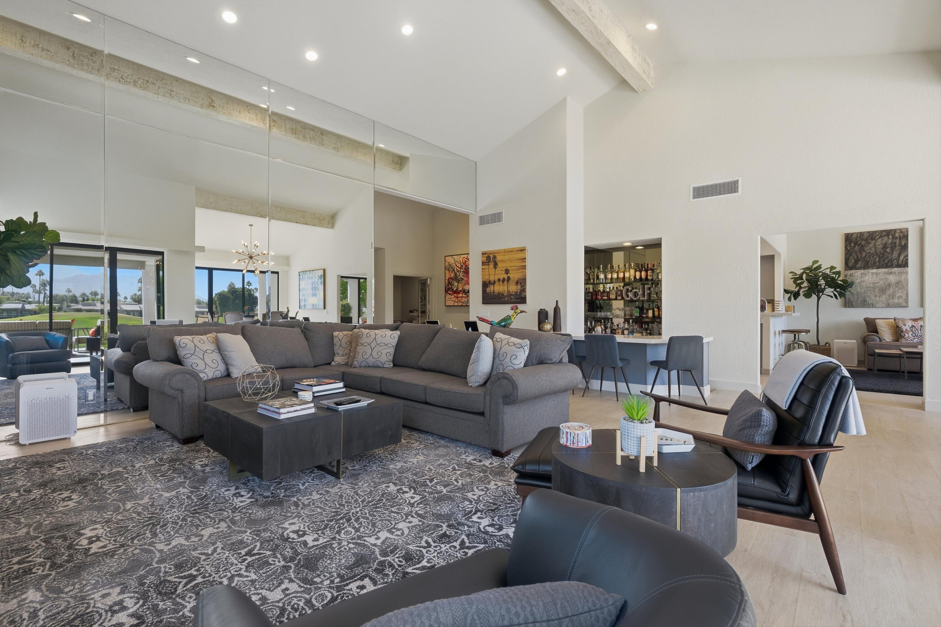 54672 Inverness Way La Quinta, CA 92253 - Photo 13 of 49 a living room with furniture and a table