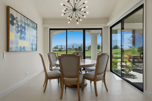 a view of a dining room with furniture window and outside view