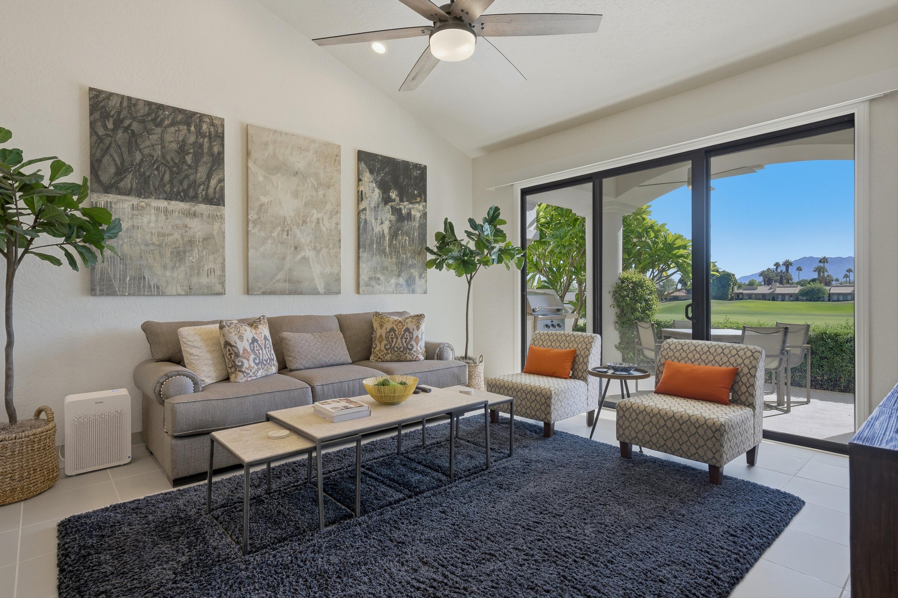 54672 Inverness Way La Quinta, CA 92253 - Photo 17 of 49 a living room with furniture and a large window