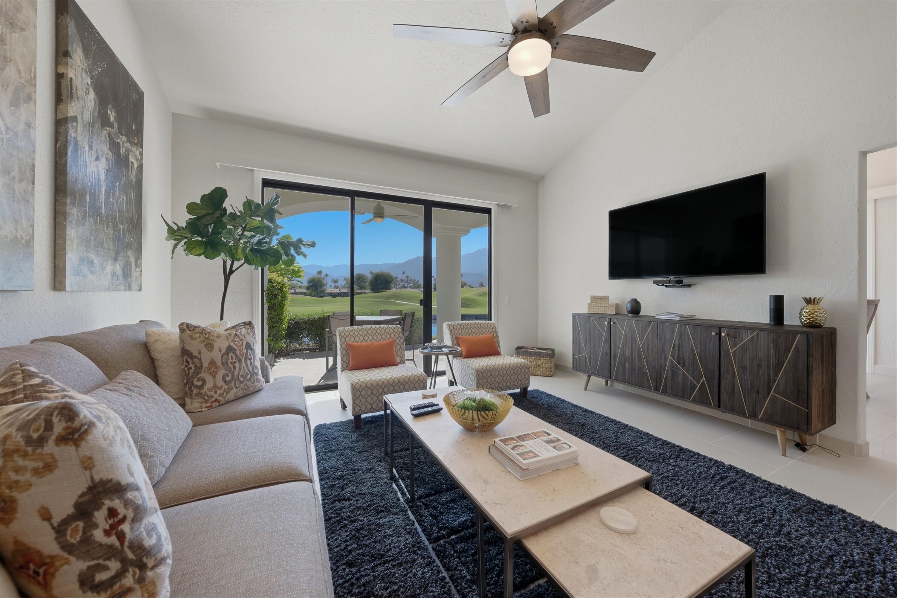 54672 Inverness Way La Quinta, CA 92253 - Photo 18 of 49 a living room with furniture and a flat screen tv