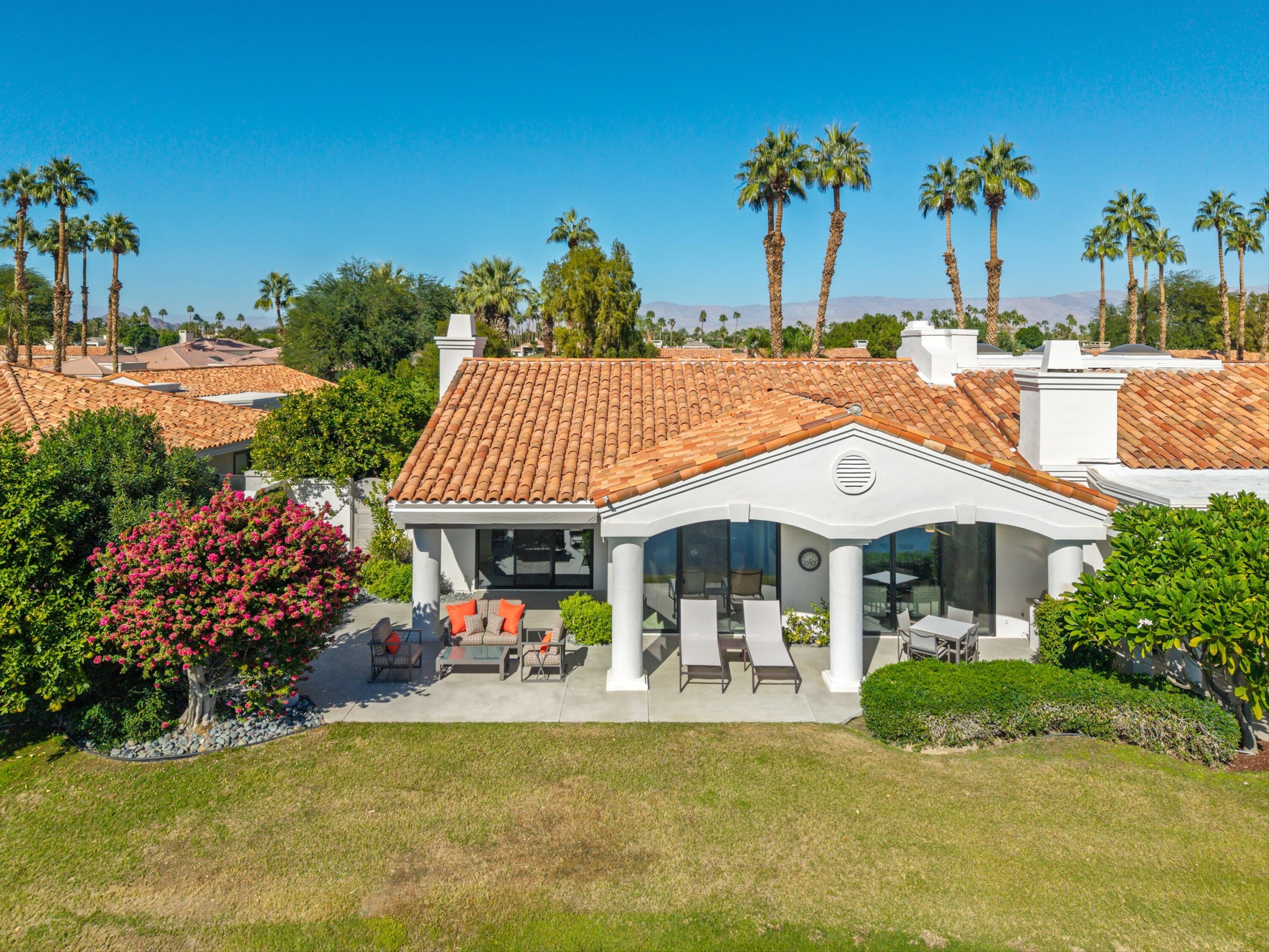 54672 Inverness Way La Quinta, CA 92253 - Photo 40 of 49 a view of a house with swimming pool and a porch