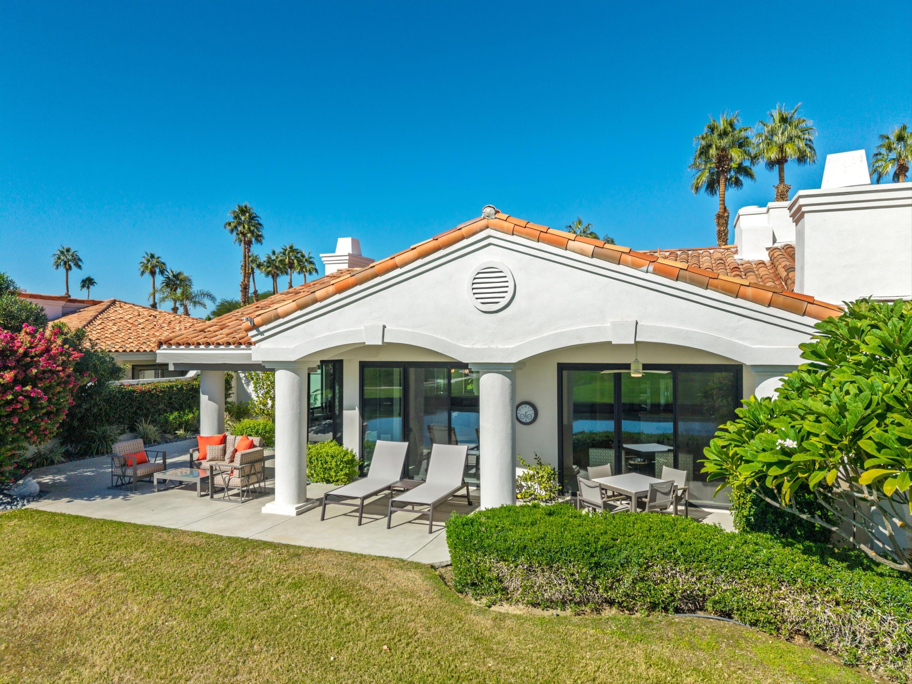 54672 Inverness Way La Quinta, CA 92253 - Photo 42 of 49 a view of a house with sitting area and swimming pool