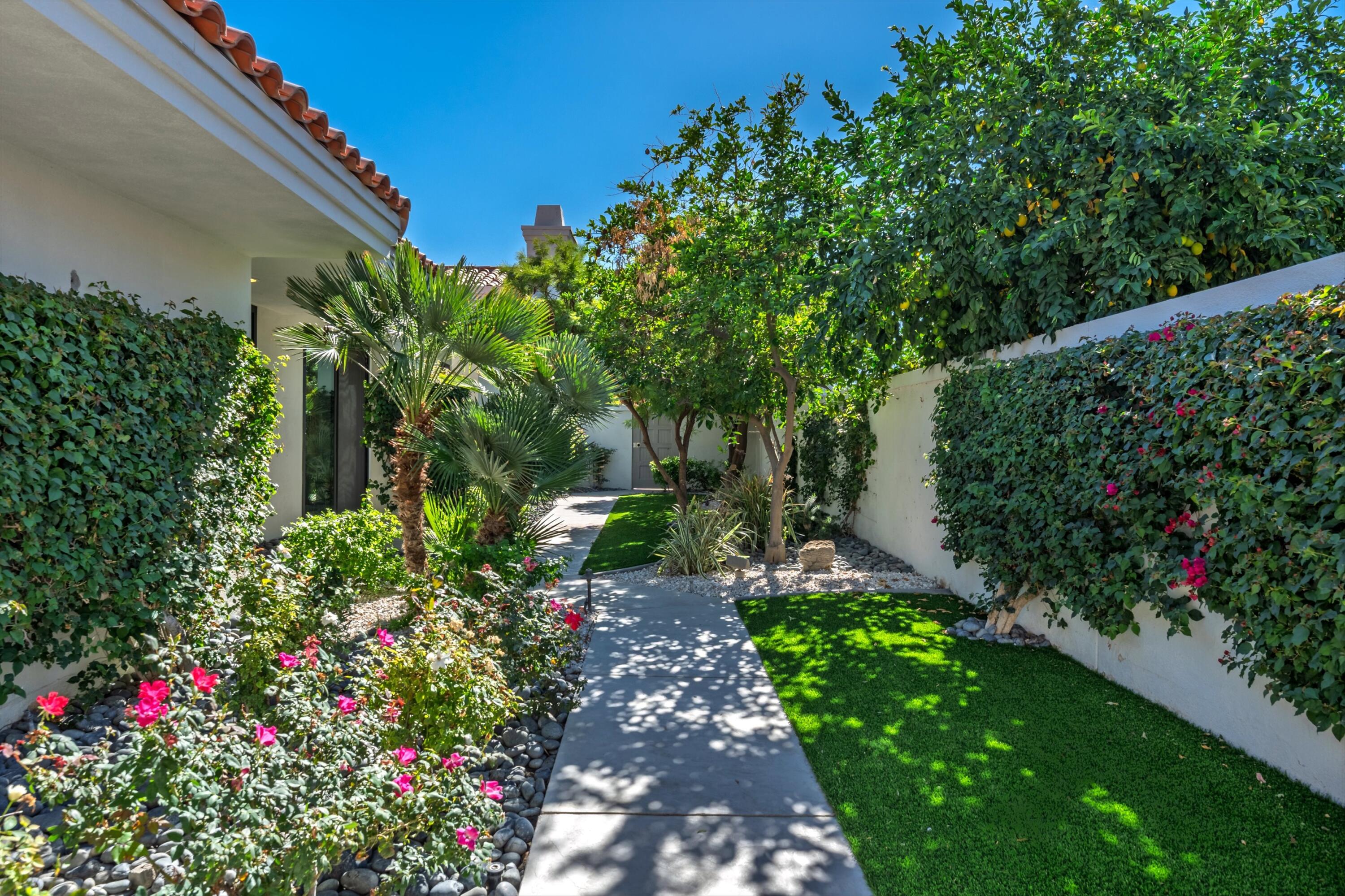 54672 Inverness Way La Quinta, CA 92253 - Photo 5 of 49 a view of a garden with flower plants