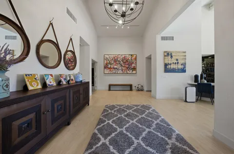 a view of a hallway with washer and dryer